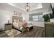 Cozy bedroom featuring a comfortable bed, stylish decor, and ample natural light at 8433 Sw 98Th Terrace Rd, Ocala, FL 34481