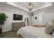 Bedroom showcases a stylish dresser, a comfortable bed, and a walk in bathroom at 8433 Sw 98Th Terrace Rd, Ocala, FL 34481