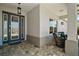 Welcoming entryway with covered porch, decorative glass door, and comfortable seating at 8433 Sw 98Th Terrace Rd, Ocala, FL 34481