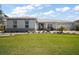 Charming single-story home with well-manicured lawn and mature landscaping under a sunny sky at 8433 Sw 98Th Terrace Rd, Ocala, FL 34481
