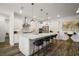 Spacious kitchen features a large center island with barstool seating and pendant lighting at 8433 Sw 98Th Terrace Rd, Ocala, FL 34481
