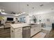 Open-concept kitchen with quartz island overlooking the living and dining areas at 8433 Sw 98Th Terrace Rd, Ocala, FL 34481