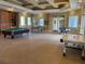 Community clubhouse game room with pool table, ping pong, and foosball table at 8815 Dunes Ct # 105, Kissimmee, FL 34747