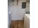 Laundry room with wood look floors, washing machine and dryer at 8815 Dunes Ct # 105, Kissimmee, FL 34747