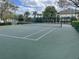 Outdoor tennis court with well-maintained surface and net; ideal for recreational play and exercise at 8815 Dunes Ct # 105, Kissimmee, FL 34747