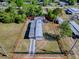 Aerial view of a beautiful home with a spacious yard, surrounded by lush greenery at 8901 Se 144Th Ln, Summerfield, FL 34491