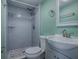 Bathroom features a shower with elegant tilework, stylish fixtures, and a modern vanity at 8901 Se 144Th Ln, Summerfield, FL 34491