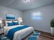 Cozy bedroom with a comfortable bed, soft lighting, and calming decor for a relaxing retreat at 8901 Se 144Th Ln, Summerfield, FL 34491