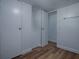 This closet features built-in storage, wood-look flooring, and white walls at 8901 Se 144Th Ln, Summerfield, FL 34491