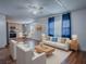 Bright living room features a seamless flow to the dining area and modern furnishings for comfortable living at 8901 Se 144Th Ln, Summerfield, FL 34491