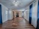 Open-concept living space with a view of the kitchen, showcasing modern appliances and ample natural light at 8901 Se 144Th Ln, Summerfield, FL 34491