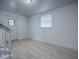 Bright room with tile flooring features an external door and window at 8901 Se 144Th Ln, Summerfield, FL 34491