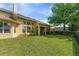 Large backyard featuring a well-maintained lawn, screened porch, and plenty of space for recreation at 1001 Harmony Ln, Clermont, FL 34711