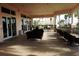 Spacious covered patio with ample seating, perfect for relaxing and entertaining with tranquil views at 1001 Harmony Ln, Clermont, FL 34711