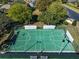 Aerial shot showcases a community sports court, perfect for tennis and pickle ball enthusiasts at 1001 Harmony Ln, Clermont, FL 34711
