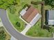 Aerial view of the home showing the roof, well-maintained yard, and extra wide driveway in a cul-de-sac at 1003 Parker Pl, Lady Lake, FL 32159