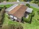 Aerial view of the home showcasing a well-maintained yard, screened porch and convenient street access at 1003 Parker Pl, Lady Lake, FL 32159