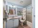 Compact bathroom featuring a vanity, toilet, and shower with glass door at 1003 Parker Pl, Lady Lake, FL 32159