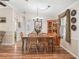 Well-lit dining room with hardwood floors and a wooden dining table at 1003 Parker Pl, Lady Lake, FL 32159
