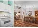 View of the kitchen featuring white appliances and accents, in an open floor plan at 1003 Parker Pl, Lady Lake, FL 32159