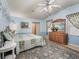 Comfortable bedroom with calming blue walls and a floral rug at 1003 Parker Pl, Lady Lake, FL 32159