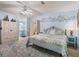 Spacious main bedroom with a ceiling fan, ensuite bathroom, and closet at 1003 Parker Pl, Lady Lake, FL 32159