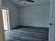 Bedroom with vinyl floors, fan and slider doors to patio at 1040 Soaring Eagle Ln, Kissimmee, FL 34746