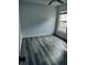 This bedroom features light gray wood-look flooring and a window for natural light at 1040 Soaring Eagle Ln, Kissimmee, FL 34746