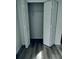 A walk-in closet with white bi-fold doors shows the closet rod and shelf at 1040 Soaring Eagle Ln, Kissimmee, FL 34746