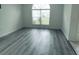 Bright room with hard surface floors and large windows allowing natural light to illuminate the room at 1040 Soaring Eagle Ln, Kissimmee, FL 34746