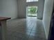 Bright living room with sliding glass doors leading to the pool and backyard at 1040 Soaring Eagle Ln, Kissimmee, FL 34746