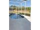 Screened-in pool with a deck, providing a private and relaxing outdoor space for swimming and leisure at 1040 Soaring Eagle Ln, Kissimmee, FL 34746