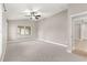 Large primary bedroom featuring vaulted ceiling and neutral colors at 10460 Silver Maple Ave, Oxford, FL 34484