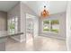 Bright dining area with vaulted ceilings and many windows at 10460 Silver Maple Ave, Oxford, FL 34484