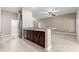 Modern kitchen featuring stainless steel appliances, granite countertops and dark wood cabinets at 10460 Silver Maple Ave, Oxford, FL 34484