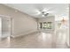 Open living room showcasing tile floors and bright sunny windows at 10460 Silver Maple Ave, Oxford, FL 34484