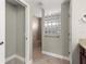 Bathroom showing tiled shower stall with glass block window at 10460 Silver Maple Ave, Oxford, FL 34484