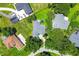 An aerial view showcasing the property's layout, backyard, and surrounding neighborhood at 11024 Windchime Cir, Clermont, FL 34711