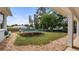 Well-maintained backyard with lush green grass, mature trees, and a trampoline for Gathering fun at 11024 Windchime Cir, Clermont, FL 34711