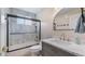 Beautiful bathroom features modern fixtures, marble tiling, and sleek glass shower at 11024 Windchime Cir, Clermont, FL 34711