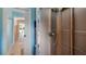 Incomplete bathroom remodeling shows open wall and doorway with new plumbing at 11024 Windchime Cir, Clermont, FL 34711