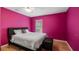 Stylish bedroom with a plush bed, modern furnishings, and hardwood floors at 11024 Windchime Cir, Clermont, FL 34711