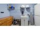 Functional laundry room with plenty of storage space and essential appliances at 11024 Windchime Cir, Clermont, FL 34711