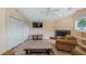 Comfortable living room features vaulted ceilings, fireplace, and modern flooring at 11024 Windchime Cir, Clermont, FL 34711