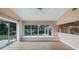 Sunlit living room with large windows overlooking the backyard at 11024 Windchime Cir, Clermont, FL 34711