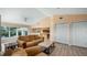 Bright living space with vaulted ceilings and access to the kitchen and backyard at 11024 Windchime Cir, Clermont, FL 34711