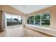 Bright and airy living room featuring large windows and sliding glass doors at 11024 Windchime Cir, Clermont, FL 34711