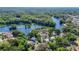 An aerial view of the community showcasing nearby waterways and dense tree coverage at 12110 Palmetto Ct, Dunnellon, FL 34432