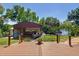 Backyard with building, deck, and water view at 12110 Palmetto Ct, Dunnellon, FL 34432