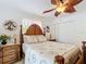 Bedroom featuring a leaf fan, palm tree bedding, and tropical decor at 12110 Palmetto Ct, Dunnellon, FL 34432